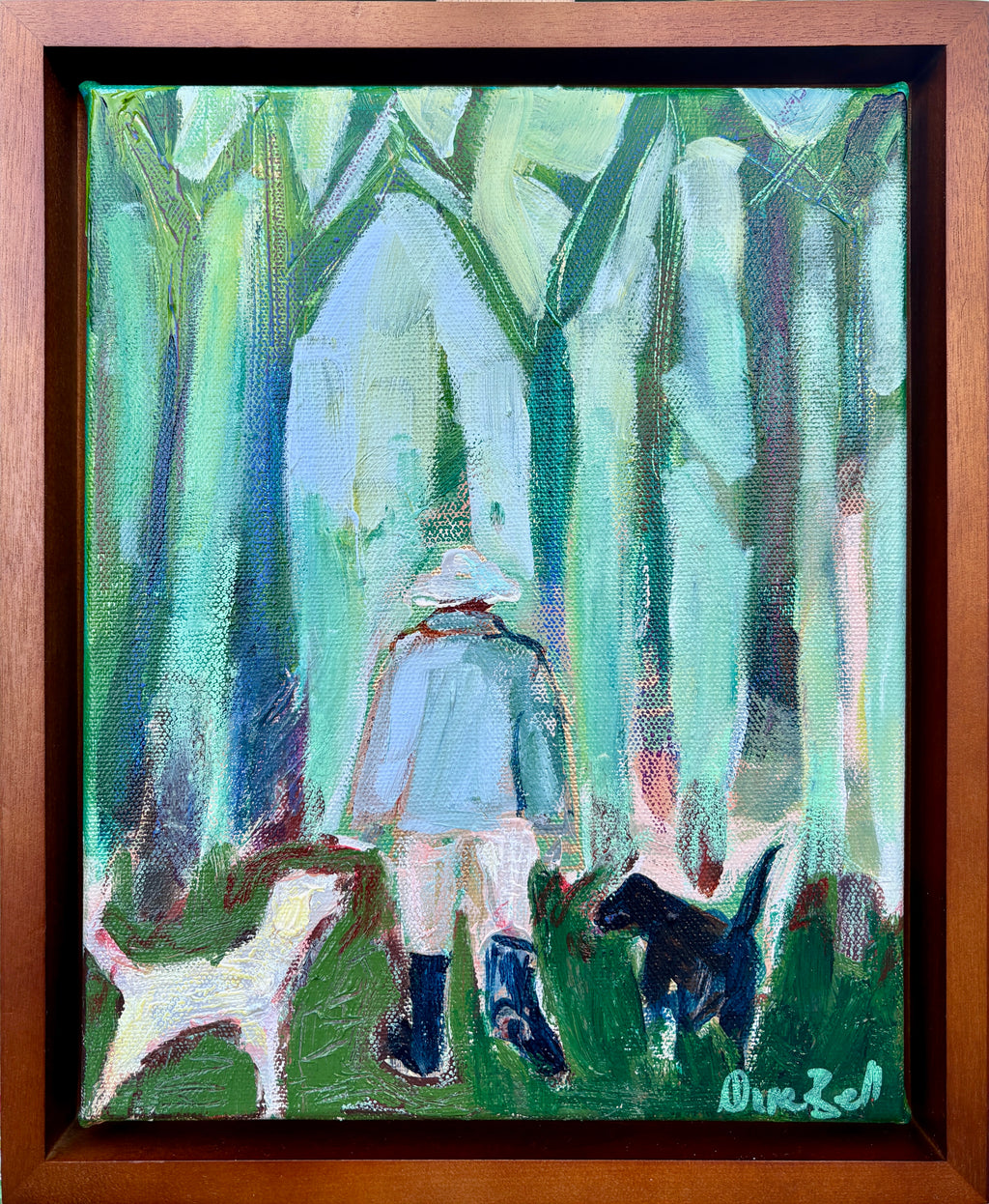 Three Good Friends, a painting of a person with two dogs beneath green and blue woodland trees, shown in a brown frame.